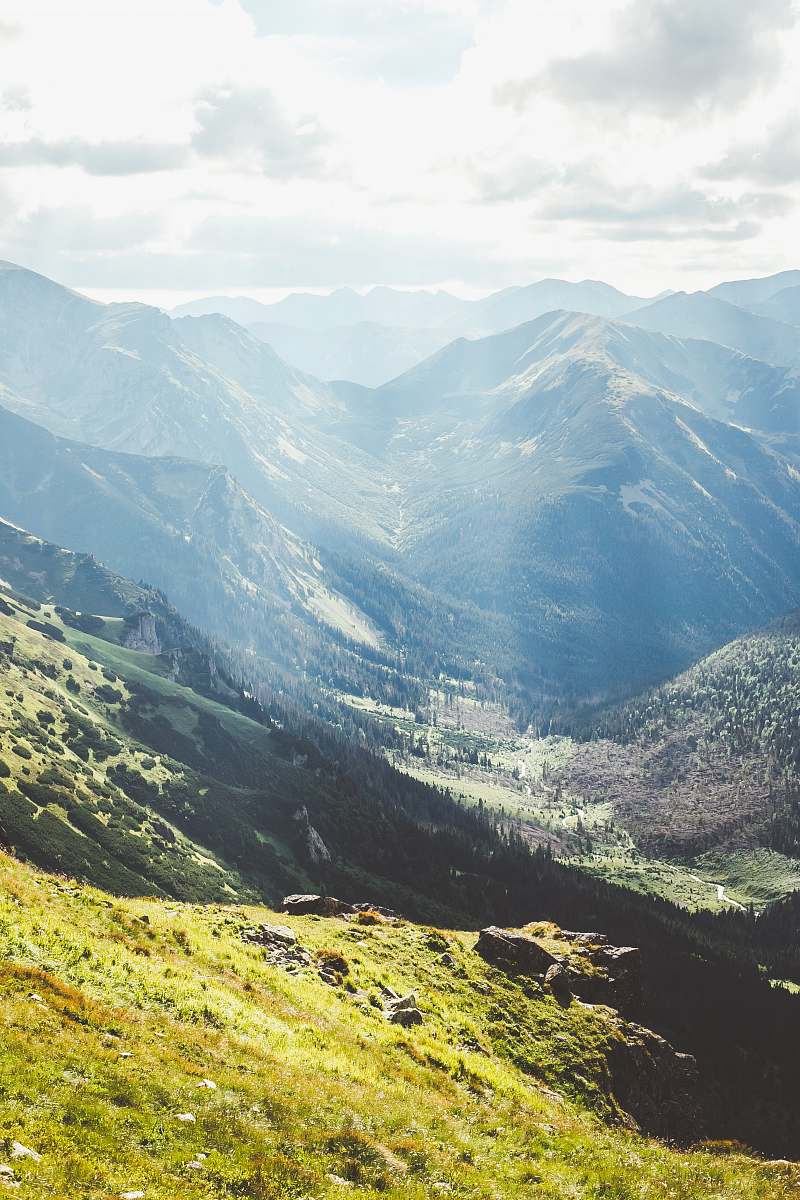 mountain range view of valley during daytime scenery
